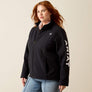 Person wearing a black jacket that says Ariat down the arm in white.