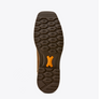 Close-up of a brown shoe sole with tread pattern on a white background