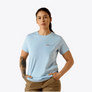 Person wearing a light blue t-shirt with a logo on a white background