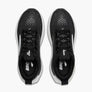 Top view of black shoes with white accents and a logo on the inside sole against a white background