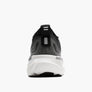 Back view of a black, grey and white shoe against a white backgorund