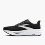 Black running shoe with white sole on a light gray background