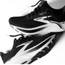 Black and white running shoes with 'Brooks' branding on a light background