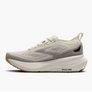 White running shoe with brown sole on a white background