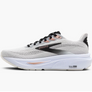 White, black and rose gold running shoes against a white background