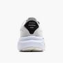 Back view of a white running shoes with black accents against a white background