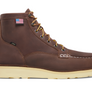 Brown boots with cream colored soles against a white backdrop.