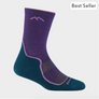 Purple and teal sock with the image of a mountain in light purple on the leg part against a light grey background.