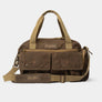 Brown canvas bag with tan and orange accents. It has two large pockets on the front.