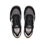 Black, grey and white sneaker with a brown sole on a white background
