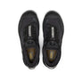 Top view of a pair of black shoes that has a grey stripe down the middle of the tough and has Keen written in yellow on the inside sole of the shoe against a white background.