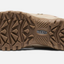 Light brown sole of a shoe that has the Keen logo in the middle of it.