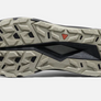 Sole of a shoe that is tan with a Keen logo in the middle against a white background.