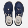 Top view of a pair of dark blue and brown shoes with white accents and the Keen logo on the tongue of the shoe against a white background.