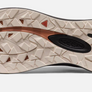 Light tan colored shoe sole with black and orange accents on the bottom and the Keen logo in the middle.