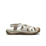Beige sandal with brown sole on a white background