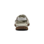 Beige sandal with brown sole on a white background