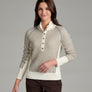Person wearing a natural colored sweater with buttons against a grey background.