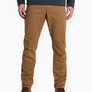 Person wearing tan pants with a grey shirt and brown shoes against a white background.