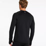 Back view of a person wearing a black long sleeve shirt against a white background.