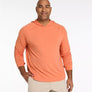 Man wearing an orange hoodie on a white background