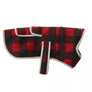 Image of a buffalo plaid dog jacket against a white background.