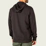 Back view of a person wearing a black hoodie and green pants.