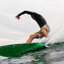 Person surfing wearing beige shorts