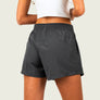 Person Wearing a skort showing the shorts on a black background
