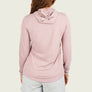 Person wearing a pink long sleeve shirt with a hood on a plain background