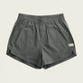 Gray shorts with a brand label on a beige background