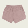 Dusty brown shorts with a pocket on the back against a beige background