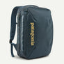 Dark blue backpack with Patagonia written in yellow on the front against a white background.