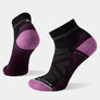Pair of black and purple socks on a light gray background