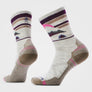 Cream colored sock with dark purple, tan and pink accents that create a skyline with a mountain.