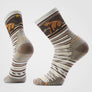 Brown, cream and orange stripped sock that has a brown bear on the upper leg of the sock.