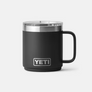 Small black mug with silver accents against a white background.
