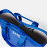 Bright blue bag against a white background.