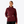 Person wearing a maroon colored sweatshirt that is 1/2 zip and has a large collar.