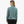 Back view of a person wearing a light teal long sleeve with black shorts against a white background.