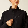 Close up image of a person wearing a black jacket holding the zipper.