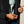 Close up image of a person un-zipping and inner pocket on a jacket.