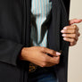 Close up image of a person un-zipping and inner pocket on a jacket.