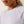 Close-up of a person wearing a light purple long sleeve Ariat T-shirt