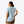 Person wearing a light blue t-shirt and beige pants on a white background
