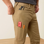 Up close image of a man wearing khaki pants with tools in his cargo pocket.