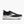 Black shoe with white accents with Brooks logo on the sole against a white background