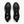 Top view of black shoes with white accents and a logo on the inside sole against a white background