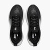 Top view of black shoes with white accents and a logo on the inside sole against a white background