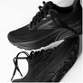 Black running shoes with 'Brooks' branding on a white background